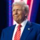 President-elect Donald Trump smiles during Turning Point USA's AmericaFest at the Phoenix Convention Center on December 22, 2024 in Phoenix, Arizona. The annual four day conference geared toward energizing and connecting conservative youth hosts some of the country's leading conservative politicians and activists. (Photo by Rebecca Noble/Getty Images)