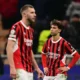 Pemain AC Milan, Joao Felix, tampak lemas setelah timnya hanya bermain imbang 1-1 melawan Feyenoord pada leg kedua play-off 16 besar Liga Champions yang digelar di San Siro, Rabu (19/2/2025) dini hari WIB. Hasil imbang itu membuat AC Milan itu tersingkir dari Liga Champions karena kalah agregat 1-2. (Marco BERTORELLO / AFP)